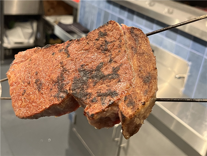 steak emerging from the kiln before resting